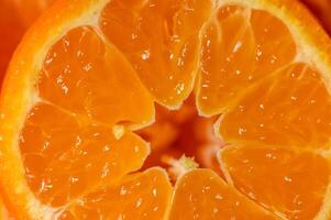 Juicy orange slices reveal refreshing texture and vibrant color in a close-up view photo
