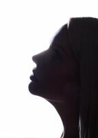 Silhouette of a woman s face on a white background photo