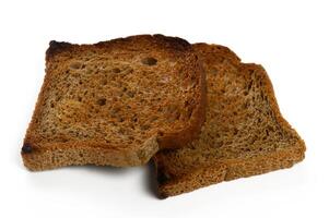 Toasted bread slices sit together on a clean white surface waiting for delicious toppings or spreads photo