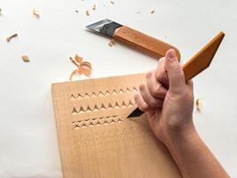 Wood carving hand tools and techniques on blank canvas photo