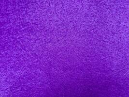 Vibrant purple texture with rough surface and rich color depth photo