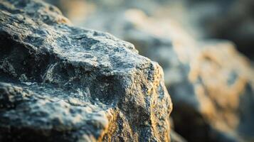 Large rock covered in dirt sits on the ground. The dirt is thick and layered, giving the rock a rough and rugged appearance. The rock is surrounded by other rocks, creating a natural landscape photo