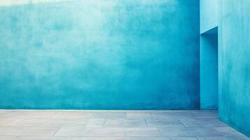 Blue wall with a white border. The wall is empty and has no furniture or decorations. The room is bare and simple photo