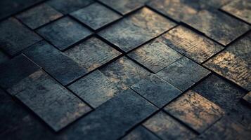 Close up of a black and grey tile floor. The tiles are arranged in a pattern that resembles a mosaic. Scene is one of simplicity and minimalism photo