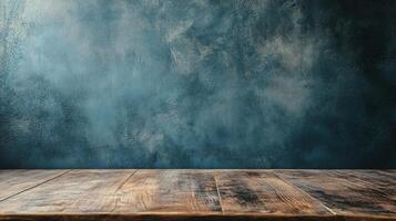 Wooden table with a blue wall behind it. The table is empty and the wall is painted blue photo