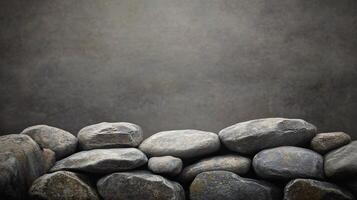 Wall of rocks with a gray background. The rocks are of various sizes and are piled up in a way that creates a sense of depth and texture photo