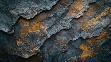 Rocky surface with a mix of blue and brown colors. The rocks are jagged and rough, giving the impression of a harsh and rugged environment. The contrast between the blue photo