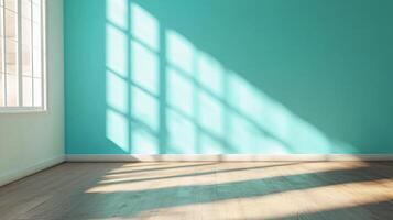 Large, empty room with a blue wall and a window. The room is very bright and airy, with a lot of natural light coming in through the window photo