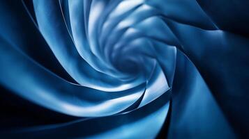 Blue and white spiral with a white line in the middle. The spiral is blue and white, and it is a part of a larger design. The spiral is curved and he is a part of a larger pattern or image photo