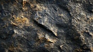 Close up of a rock with a yellowish tint. The rock is rough and has a lot of texture photo