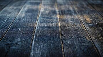 The image is of a wooden floor with a dark blue color. The floor is made of wood and has a grainy texture. The floor appears to be old and worn, with some areas looking like they have been burned photo
