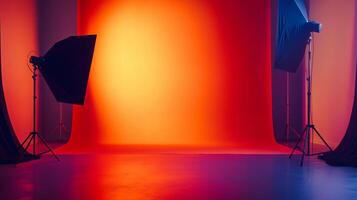 Studio with two lighting stands and a red wall. The lighting stands are on the left and right side of the wall photo