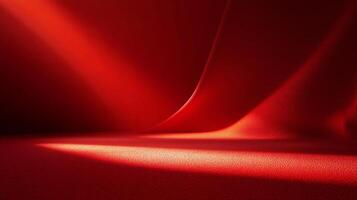 Red background with a red fabric in the foreground. The fabric is folded and has a shiny, reflective surface. The image has a warm, inviting mood and is reminiscent of a luxurious, elegant setting photo