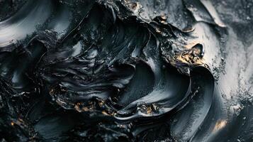The image is of a black and white painting of a wave. The painting is very abstract and has a lot of texture, giving it a sense of depth and movement. The mood of the painting is somewhat somber photo