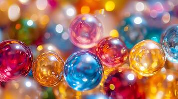 Bunch of colorful glass balls are scattered across the image. The colors are bright and vibrant, creating a cheerful and lively atmosphere. The balls are of various sizes photo