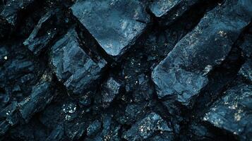 Close up of a rock with a blue hue. The rock is rough and jagged, with a dark color photo