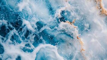 Beautiful blue ocean with foam and bubbles. The foam is white and the bubbles are yellow. The ocean is calm and peaceful, with the foam and bubbles adding a sense of movement and life to the scene photo