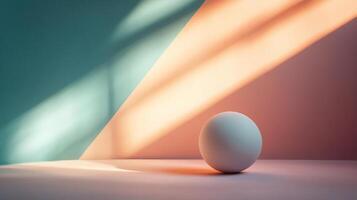 White ball is sitting on a white surface in front of a blue wall. The ball is the only object in the image, and it is the main focus. The blue wall and the white surface create a sense of contrast photo