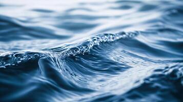 Wave in the ocean with a lot of water. The water is very blue and the wave is very large. Scene is calm and peaceful, as the water is still and the wave is gentle photo