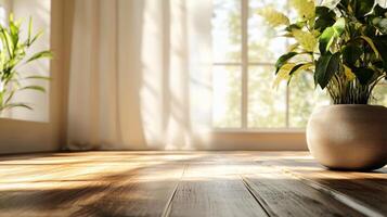 Potted plant sits on a wooden floor in front of a window. The sunlight is shining on the plant, making it look vibrant and healthy. The room has a clean and minimalist look photo