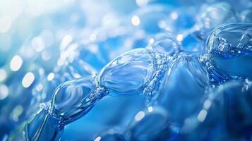 The image is of a blue water droplet with a blurry background. The droplet is surrounded by other droplets, creating a sense of movement and fluidity photo