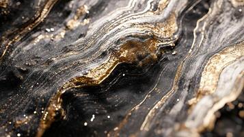 Gold and black patterned surface with a shiny texture. The gold and black colors create a sense of luxury and elegance photo