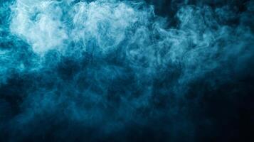 Blue sky with a thick, dense cloud of smoke. The smoke is so thick that it almost obscures the sky, creating a mood of mystery and unease. The blue sky and the smoke contrast with each other photo