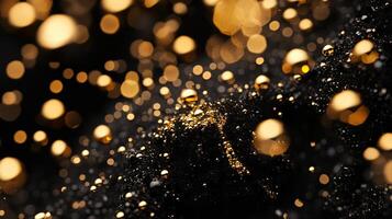 Close up of a black background with gold glitter. The glitter is scattered all over the background, creating a sense of movement and energy. The image has a dreamy, ethereal quality to it photo