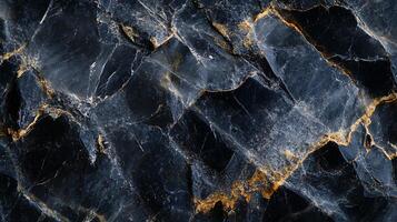 Black and gold stone with a shiny surface. The stone is rough and has a jagged edge photo