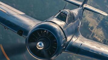 Fighter plane is flying in the sky. The plane is blue and has a propeller. The pilot is looking down at the ground photo