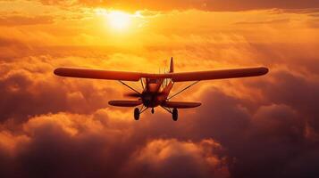 Small plane is flying through a cloudy sky with a bright orange sun in the background. Concept of freedom and adventure photo