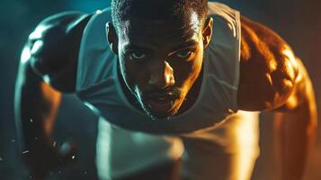 Man is running with his arms crossed and his head down. He is sweating and he is in a hurry photo