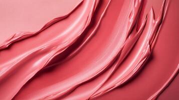 Close up of a pink lip gloss with a shiny, smooth texture. The lip gloss is applied in a way that creates a sense of movement and flow, giving the impression of a soft, natural look photo
