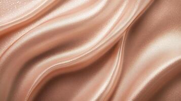 Gold fabric with a wavy pattern. The fabric is shiny and looks like it has a lot of texture photo