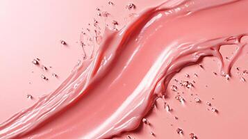 Splash of pink liquid is splashed across a pink background. The splash is made up of small droplets of liquid, creating a sense of movement and energy. The pink color of the liquid photo