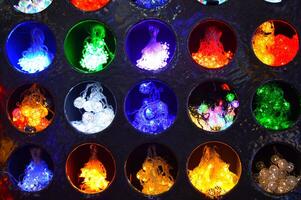 abstract background of multicolored lights burning in recesses each in its own circle. High quality photo