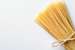 Fresh ingredients for a classic pasta dish with tomatoes and basil on a clean background photo