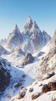 Majestic snow covered mountains with evergreen trees under clear blue sky photo