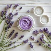 Lavender scented cream with fresh lavender and sea salt on a wooden surface photo