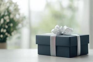 Elegant gift box on a table with flower arrangement in a bright room photo