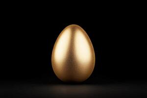 Shiny gold egg on a dark surface reflecting light beautifully photo