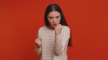 Angry aggressive woman trying to fight at camera, shaking fist, boxing with expression, punishment video