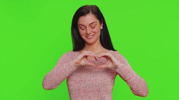 Smiling one woman makes heart gesture demonstrates love sign expresses good feelings and sympathy video