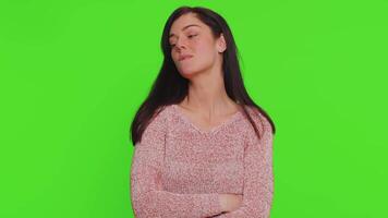 Smiling playful pretty young woman blinking eyes, looking at camera with smile, winking, flirting video