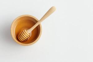 Wooden bowl with spoon on a plain background for culinary presentation photo