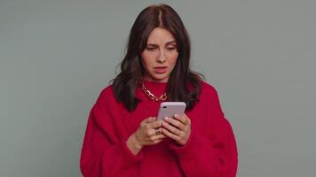 Woman use smartphone typing browsing, loses becoming surprised sudden lottery results, bad fortune video