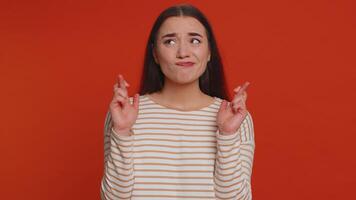 Stylish woman in pullover shouting, raising fists in gesture I did it, celebrating success, winning video