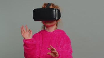 Preteen child girl kid using headset app to play simulation game watching virtual reality 3D video