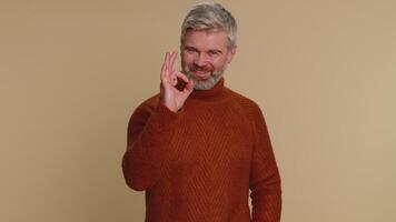 Man looking approvingly, showing ok approve feedback gesture like sign positive something good video