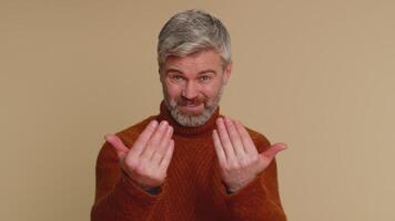 Man showing a little bit gesture with sceptic smile, showing minimum sign, measuring small size video